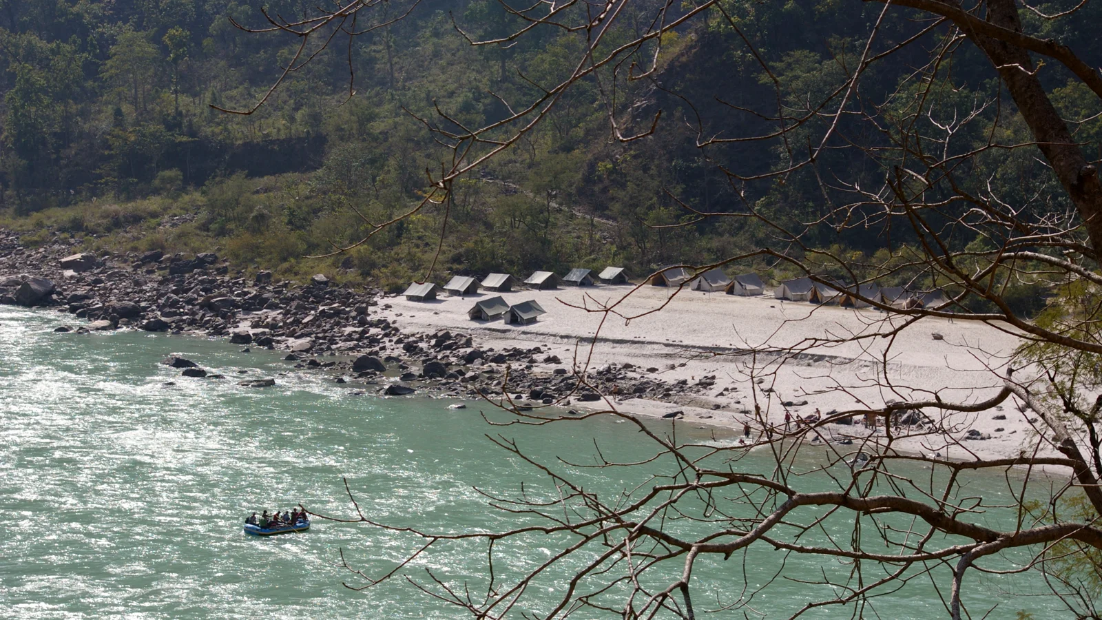 Riverside camping tents pitched along the Ganges river valley in Uttarakhand