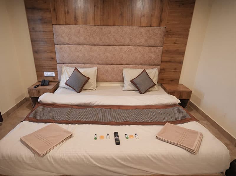 Cottage bedroom interior with attached sitting area at Chail Camps & Cottages