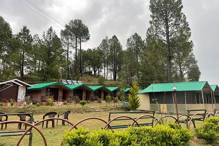 Terraced hillside pathways leading to cottages at Shimla Camps & Cottages